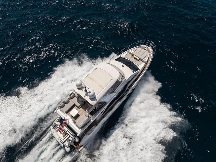  Yacht Photos Pics Aerial view of 2022 Azimut Fly 60 yacht cruising on open water.