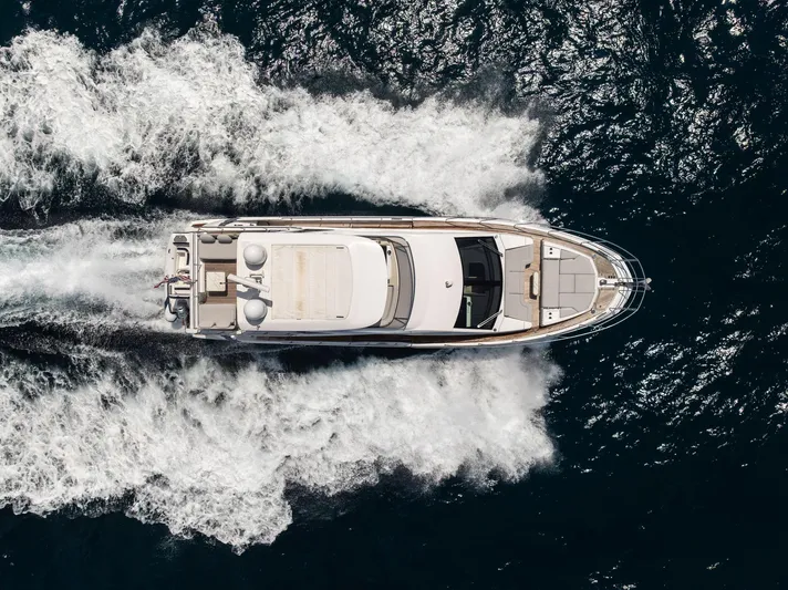  Yacht Photos Pics Azimut Fly 60 yacht cruising on open water, aerial view, 2022 model.