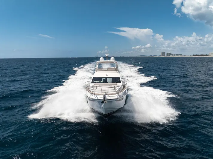  Yacht Photos Pics Azimut Fly 60 yacht cruising on open sea, 2022 model, under clear blue sky.