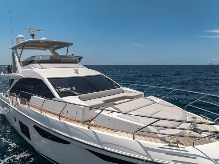  Yacht Photos Pics 2022 Azimut Fly 60 yacht cruising on open sea under clear blue sky.