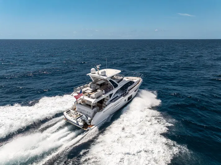  Yacht Photos Pics Azimut Fly 60 yacht cruising on open sea, 2022 model, creating waves under clear blue sky.