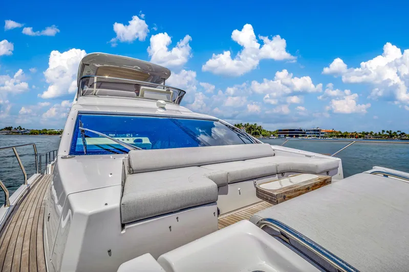  Yacht Photos Pics Azimut Fly 60 yacht, 2022 model, cruising on a sunny day with blue skies.