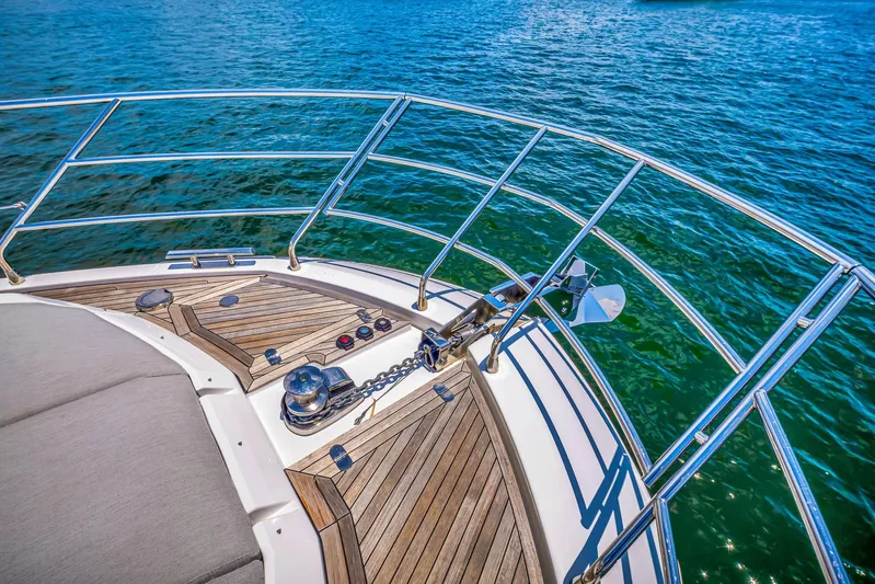  Yacht Photos Pics Bow of 2022 Azimut Fly 60 yacht with teak decking and stainless steel railings.