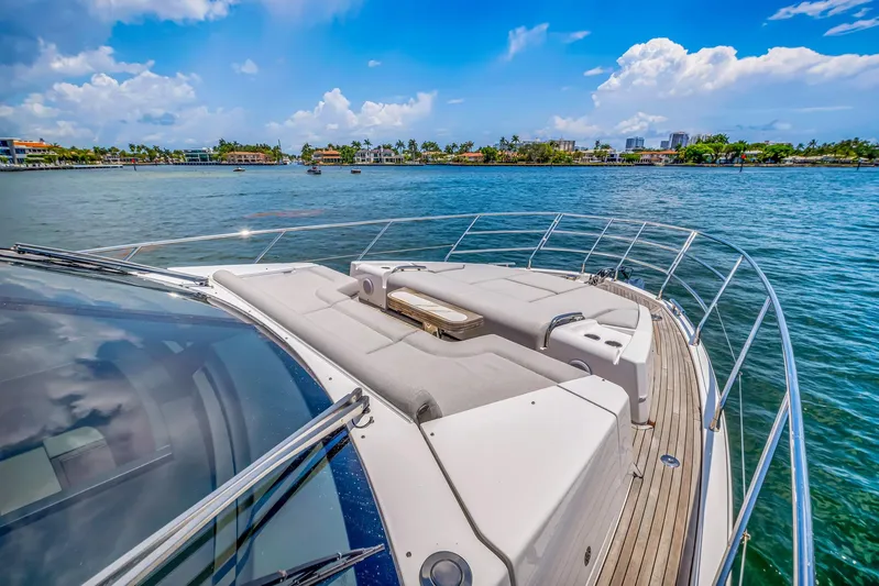  Yacht Photos Pics Azimut Fly 60 yacht, 2022 model, cruising on a sunny day with scenic waterfront views.