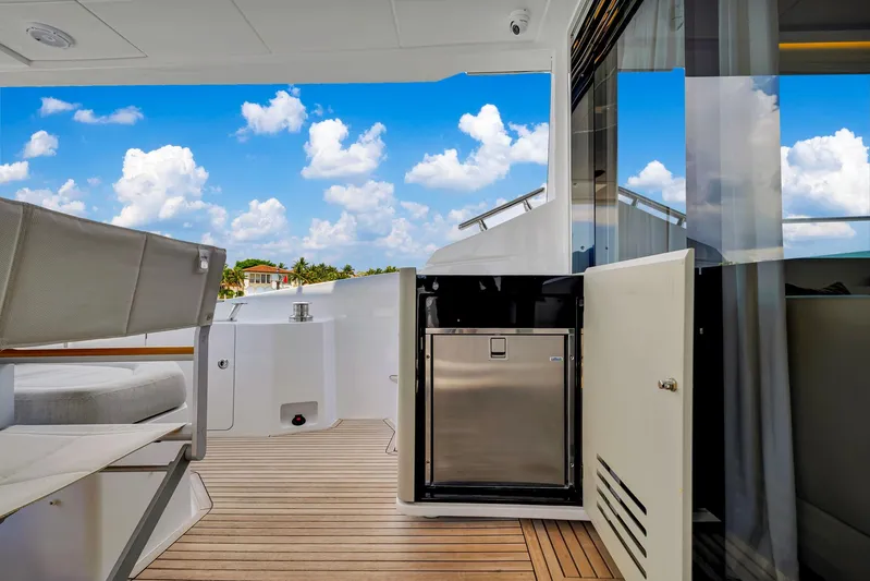  Yacht Photos Pics Azimut Fly 60 yacht deck, 2022 model, featuring sleek design and modern amenities under a blue sky.