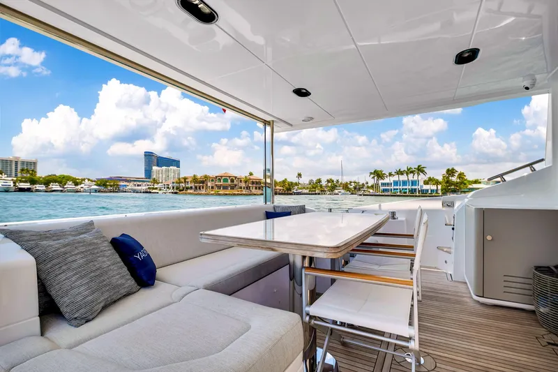  Yacht Photos Pics Luxurious 2022 Azimut Fly 60 yacht deck with seating and ocean view.