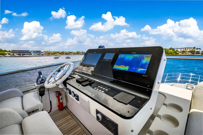  Yacht Photos Pics Helm of 2022 Azimut Fly 60 yacht with navigation screens and ocean view.