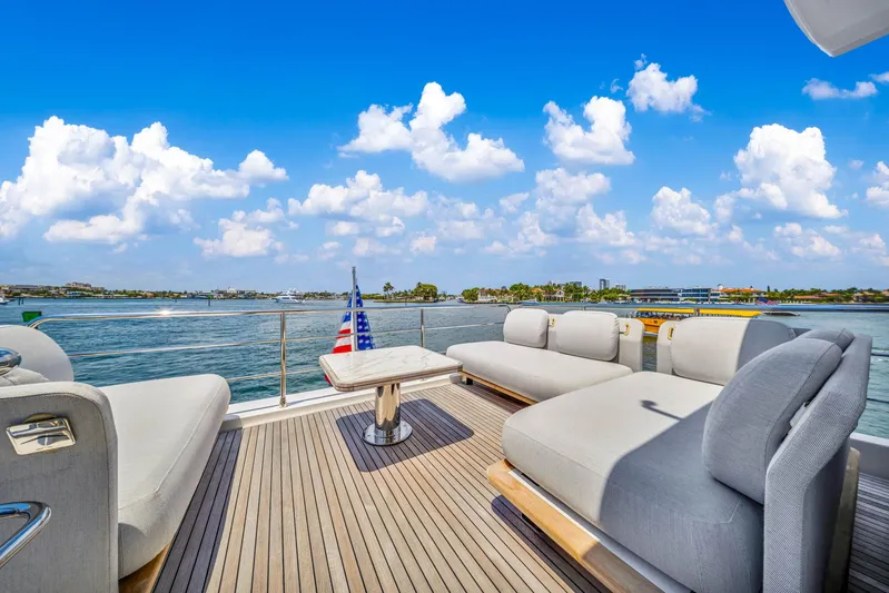  Yacht Photos Pics Luxurious deck of 2022 Azimut Fly 60 yacht with plush seating and scenic ocean view.