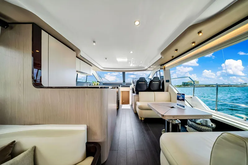  Yacht Photos Pics Luxurious interior of 2022 Azimut Fly 60 yacht with modern furnishings and ocean view.