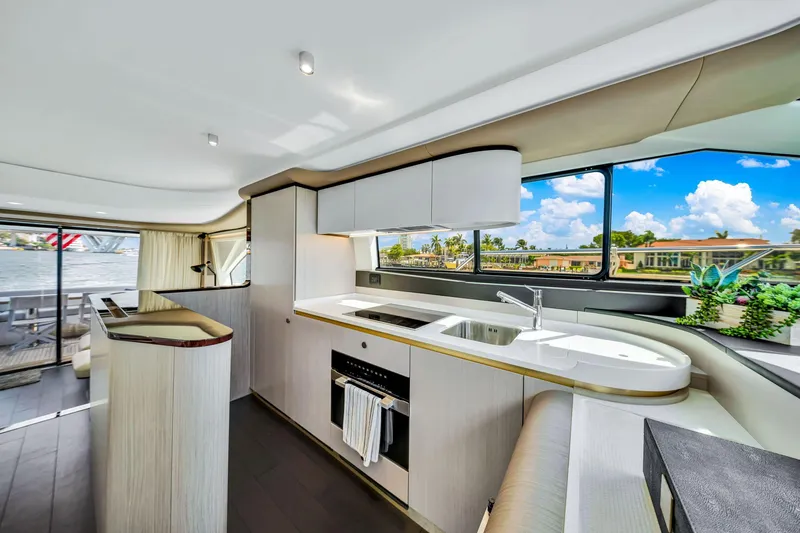  Yacht Photos Pics Luxurious interior of 2022 Azimut Fly 60 yacht with modern kitchen and scenic views.