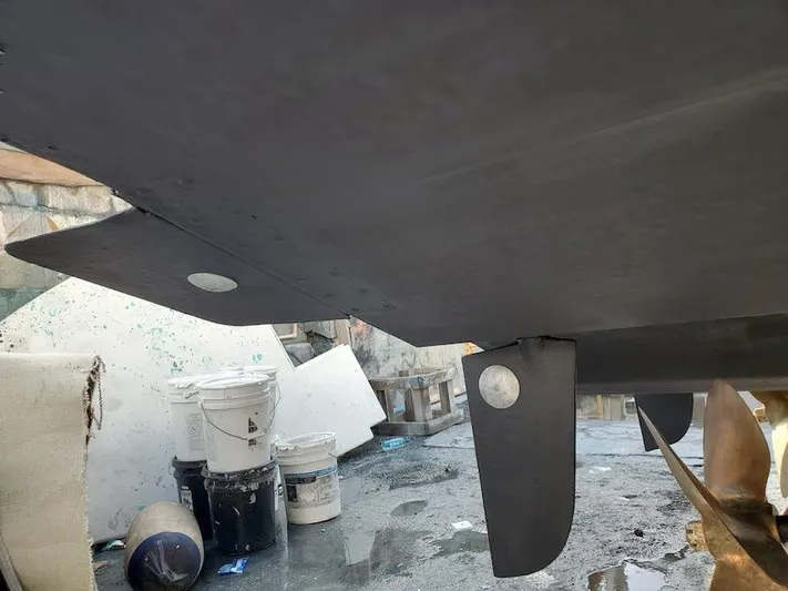  Yacht Photos Pics 1998 Viking Sports Cruiser hull with rudder, in a workshop setting.