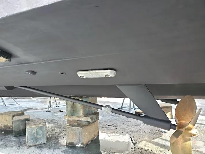  Yacht Photos Pics Underneath view of a 1998 Viking Sports Cruiser with visible propeller and support blocks.