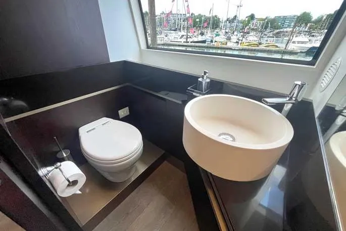  Yacht Photos Pics Luxurious bathroom on 2020 Ferretti Yachts 850 with marina view.