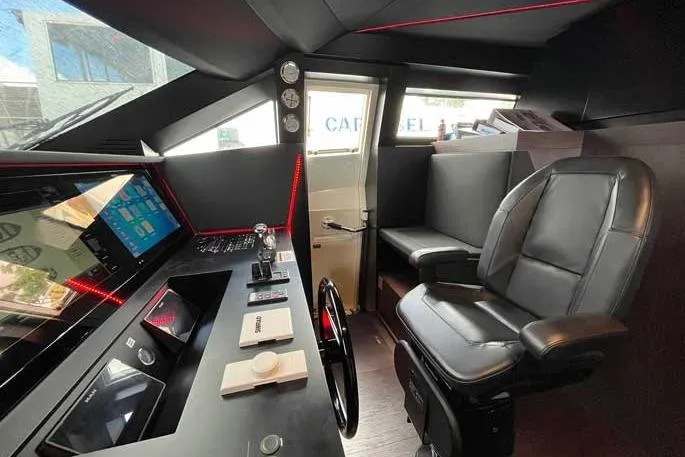  Yacht Photos Pics Cockpit of 2020 Ferretti Yachts 850 with modern controls and leather seating.