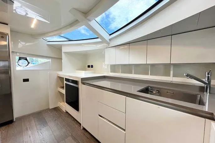  Yacht Photos Pics Modern kitchen interior of 2020 Ferretti Yachts 850 with sleek design and skylight.