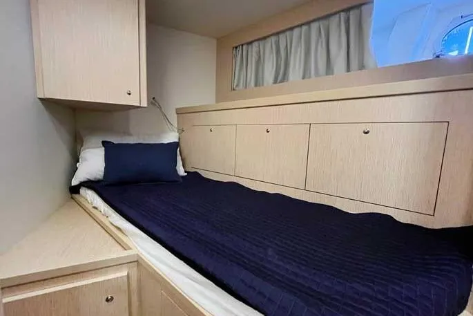  Yacht Photos Pics Luxurious cabin interior of 2020 Ferretti Yachts 850 with sleek wood finish.