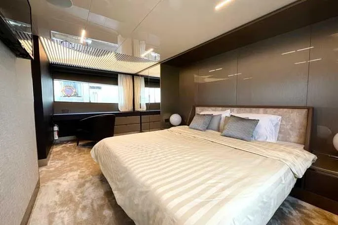  Yacht Photos Pics Luxurious bedroom interior of 2020 Ferretti Yachts 850 with modern design and elegant furnishings.