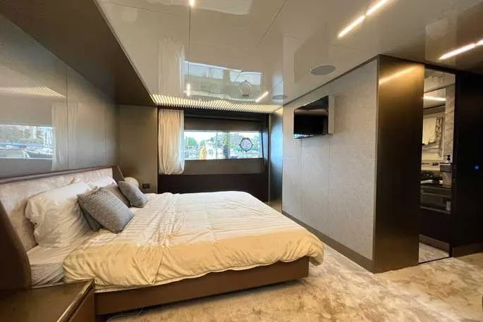  Yacht Photos Pics Luxurious bedroom interior of 2020 Ferretti Yachts 850, featuring modern design and elegant furnishings.