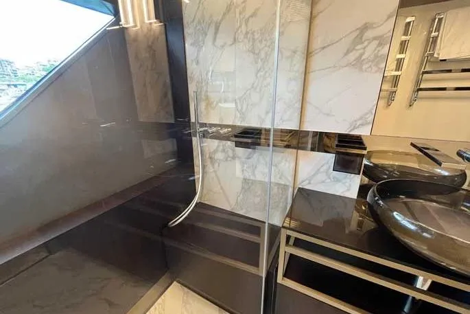  Yacht Photos Pics Luxurious bathroom interior of 2020 Ferretti Yachts 850 with marble and modern fixtures.