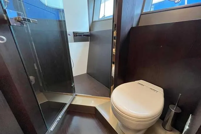  Yacht Photos Pics Luxurious bathroom in 2020 Ferretti Yachts 850, featuring modern shower and toilet.