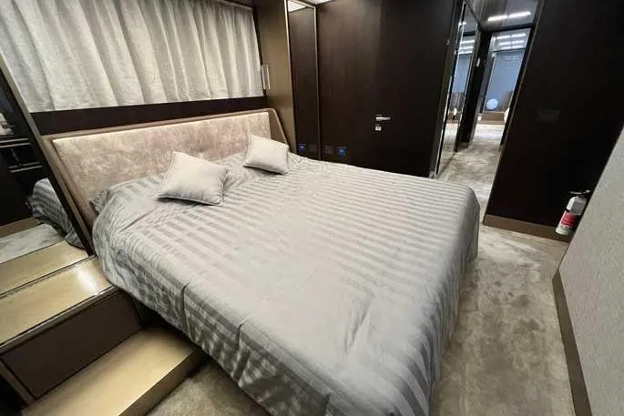  Yacht Photos Pics Luxurious bedroom interior of 2020 Ferretti Yachts 850 with elegant bedding and modern design.