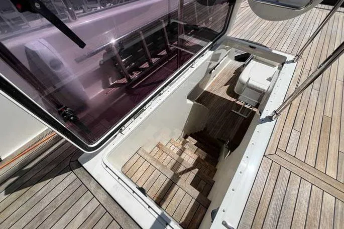  Yacht Photos Pics Staircase leading below deck on 2020 Ferretti Yachts 850, featuring wooden flooring.