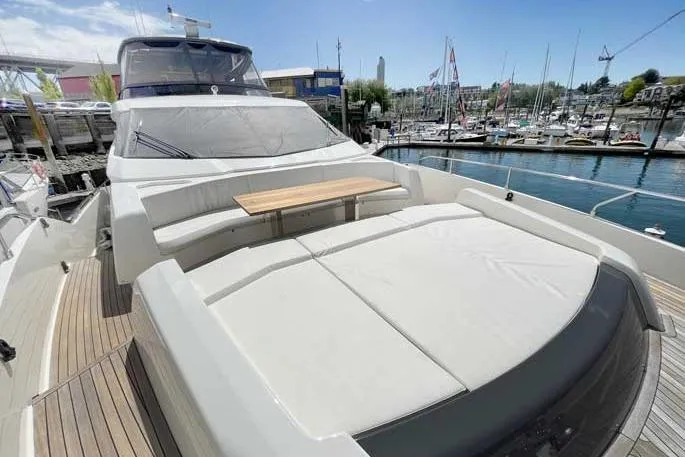  Yacht Photos Pics 2020 Ferretti Yachts 850 at marina, featuring spacious deck and seating area.