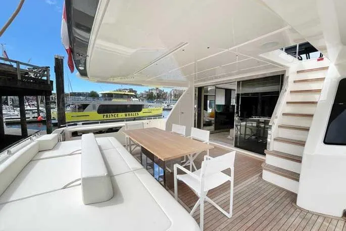  Yacht Photos Pics Outdoor deck of 2020 Ferretti Yachts 850 with seating and dining area.