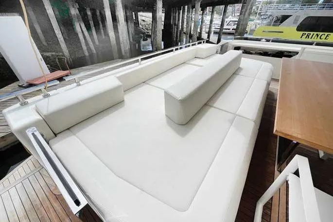  Yacht Photos Pics Luxurious seating area on 2020 Ferretti Yachts 850, featuring elegant white upholstery.
