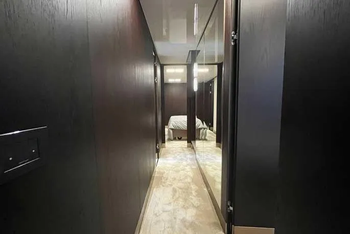  Yacht Photos Pics Luxurious hallway in 2020 Ferretti Yachts 850, leading to a cozy bedroom.