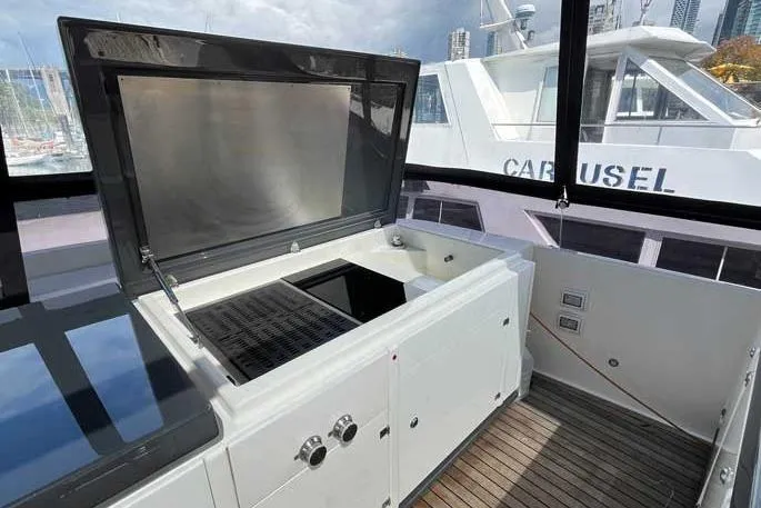  Yacht Photos Pics Outdoor kitchen on 2020 Ferretti Yachts 850, featuring a grill and sink.