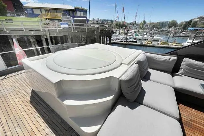  Yacht Photos Pics Luxurious 2020 Ferretti Yachts 850 with spacious deck seating and marina view.