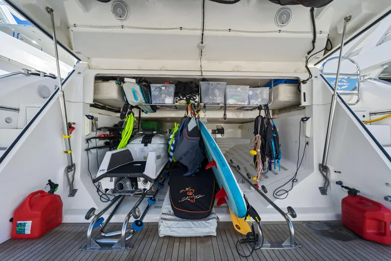  Yacht Photos Pics Storage area of 2013 Sunseeker Predator 84 yacht with water sports equipment.