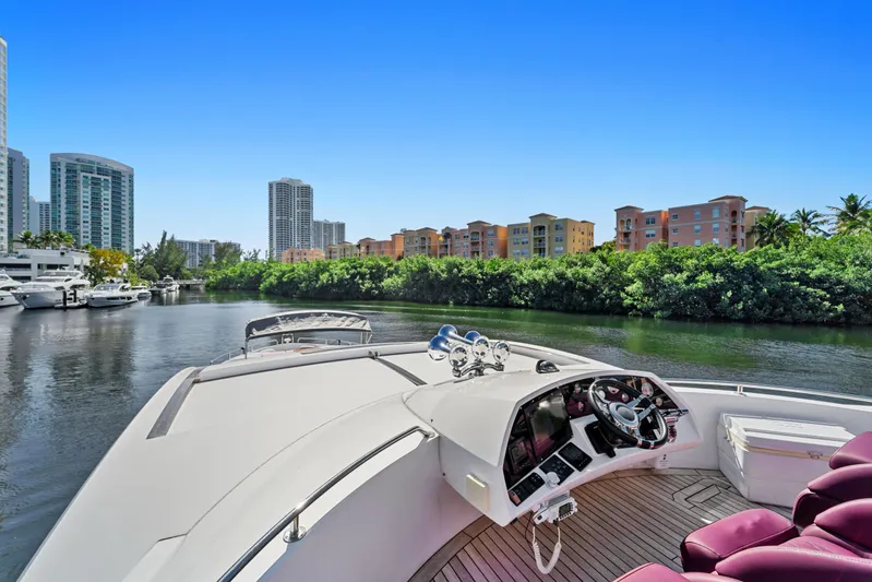  Yacht Photos Pics Sunseeker Predator 84 yacht cruising near urban waterfront, 2013 model.