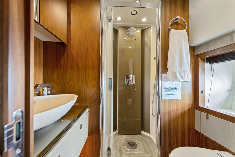  Yacht Photos Pics Luxurious bathroom on 2013 Sunseeker Predator 84 yacht with modern shower and elegant fixtures.