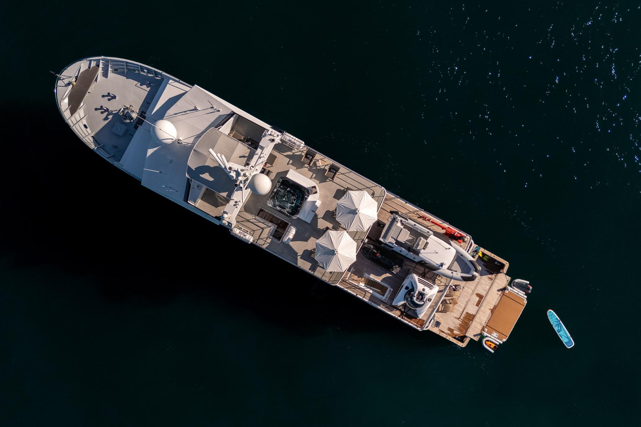 Aerial view of 2005 Tenix Defence ICE Explorer yacht on dark water.