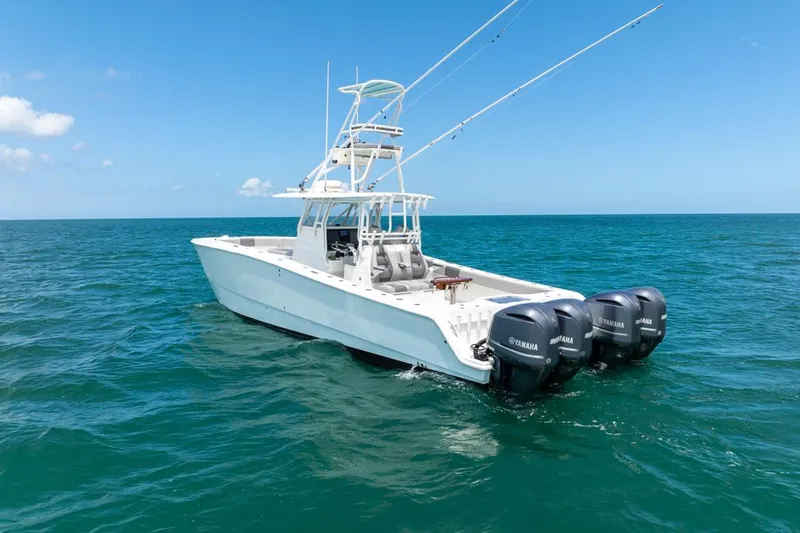  Yacht Photos Pics 2018 Freeman 37 VH boat with triple Yamaha engines on open sea.