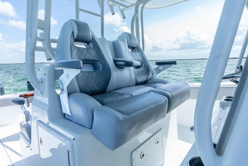  Yacht Photos Pics Luxury seating on a 2018 Freeman 37 VH boat, featuring ocean backdrop.