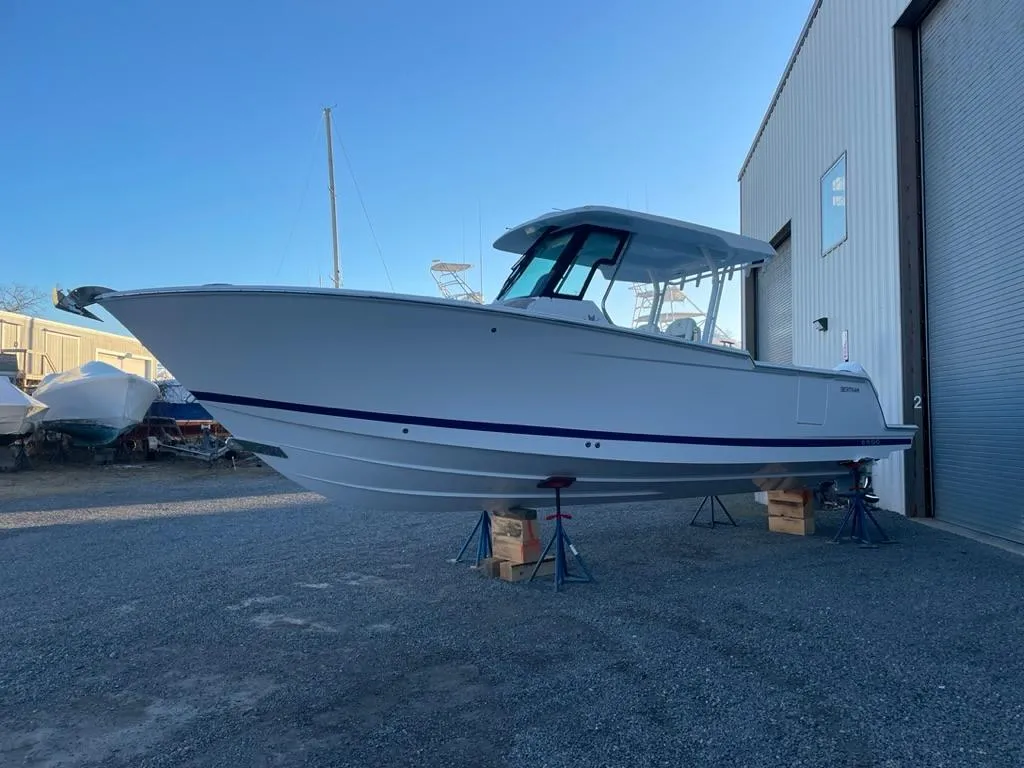 2023 Bertram 28 CC boat on stands outside a storage facility.