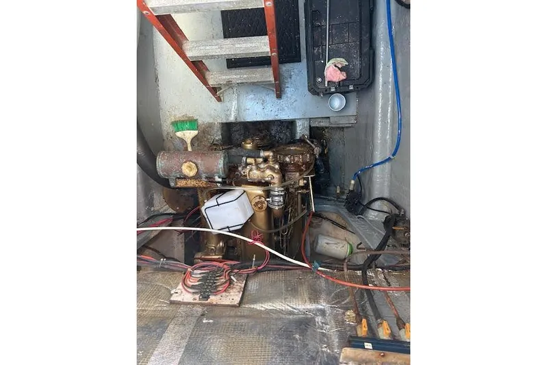 Liahona Yacht Photos Pics Engine room of a 1985 Custom 60 boat with visible wiring and components.