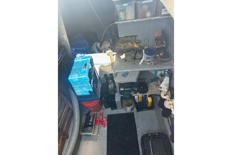 Liahona Yacht Photos Pics Workshop with tools and supplies on shelves, featuring a Custom 60 model from 1985.