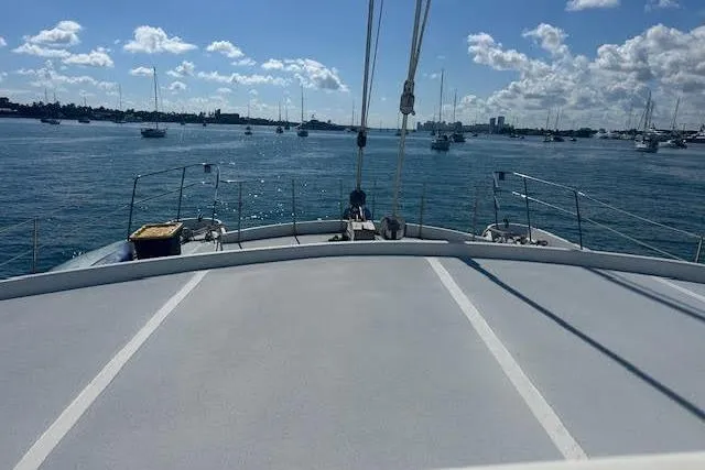 Liahona Yacht Photos Pics Bow view of a 1985 Custom 60 yacht on a sunny day at sea.