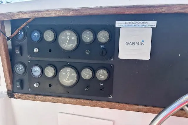 Liahona Yacht Photos Pics Control panel of a 1985 Custom 60 boat with gauges and Garmin device.