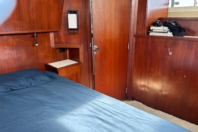 Liahona Yacht Photos Pics Cozy wooden cabin interior with bed, Custom 60 model, 1985.