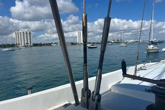 Liahona Yacht Photos Pics Sailboat deck view with city skyline, Custom 60 model, 1985.