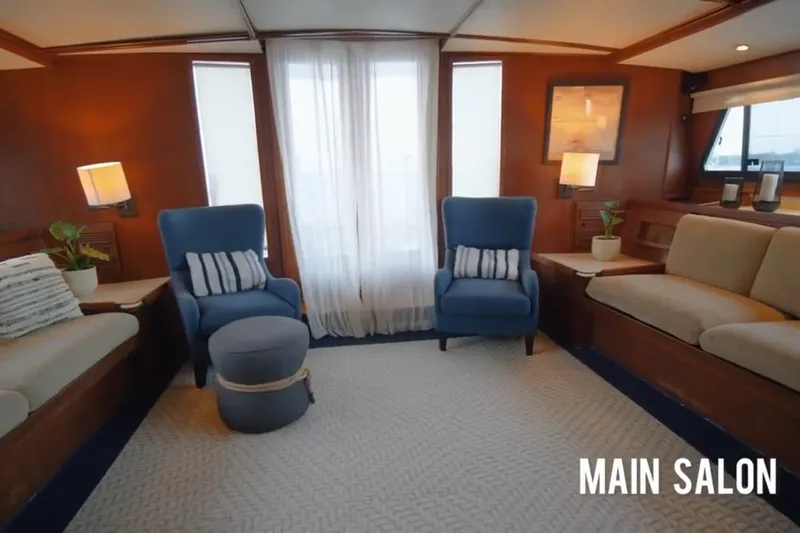 Liahona Yacht Photos Pics Main salon of 1985 Custom model 60 yacht with cozy seating and elegant decor.