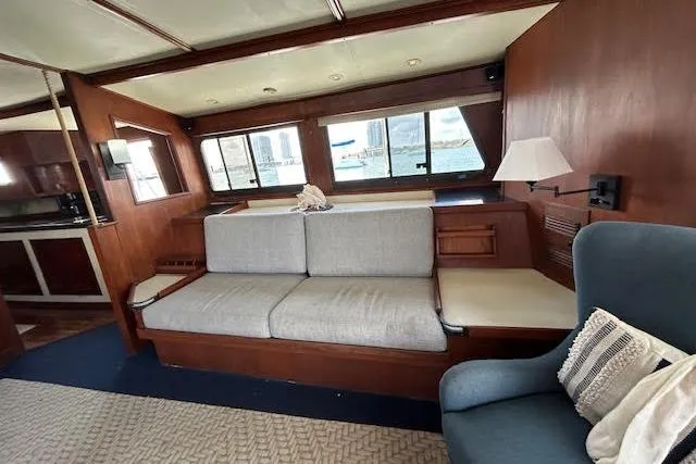 Liahona Yacht Photos Pics Cozy 1985 Custom 60 yacht interior with sofa, windows, and nautical decor.