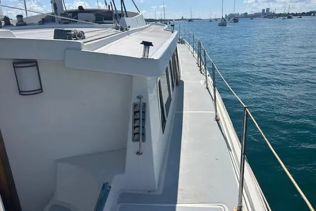 Liahona Yacht Photos Pics Custom 1985 model 60 yacht on calm waters, showcasing deck and railing.