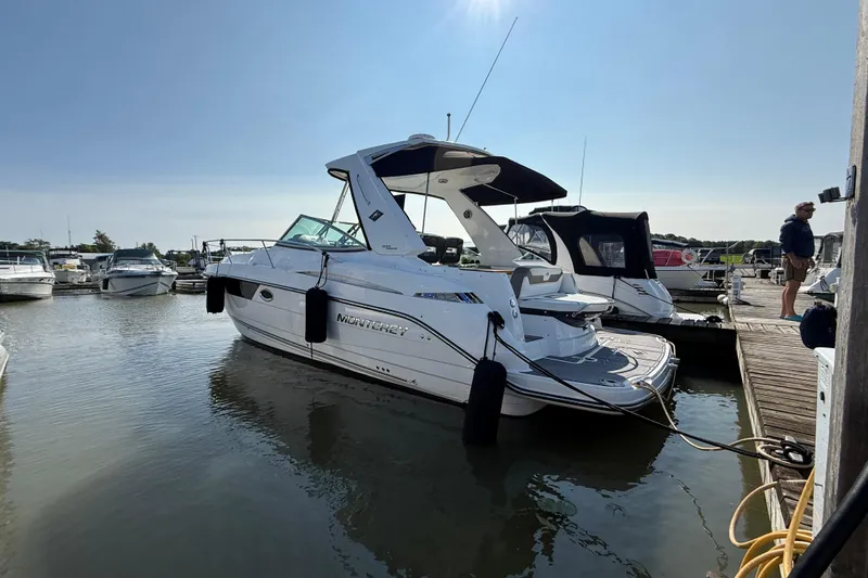  Yacht Photos Pics 2018 Monterey 355 Sport Yacht docked at marina under clear blue sky.
