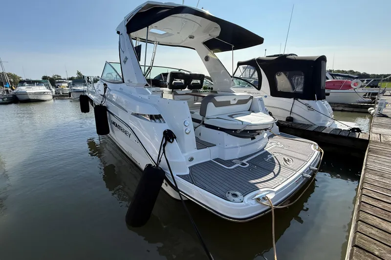  Yacht Photos Pics 2018 Monterey 355 Sport Yacht docked at marina, rear view.